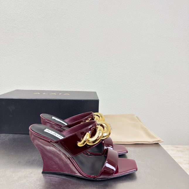 ALAIA 26S DOUBLE STRAP WEDGE SANDALS 110 MM IN DARK RED GLOSSY CALFSKIN WITH GOLD HARDWARE