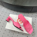SQUARE-TOE MEDIUM HEEL MULES IN PINK CALFSKIN LOGO EMBOSSED