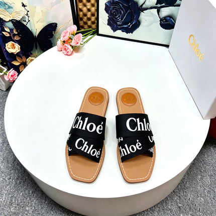 CHLOE 26S CRISSCROSS SLIDES IN BLACK CANVAS