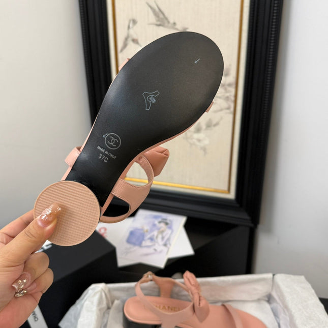 FLAT SANDALS IN PEACHY PINK CALFSKIN WITH BOW