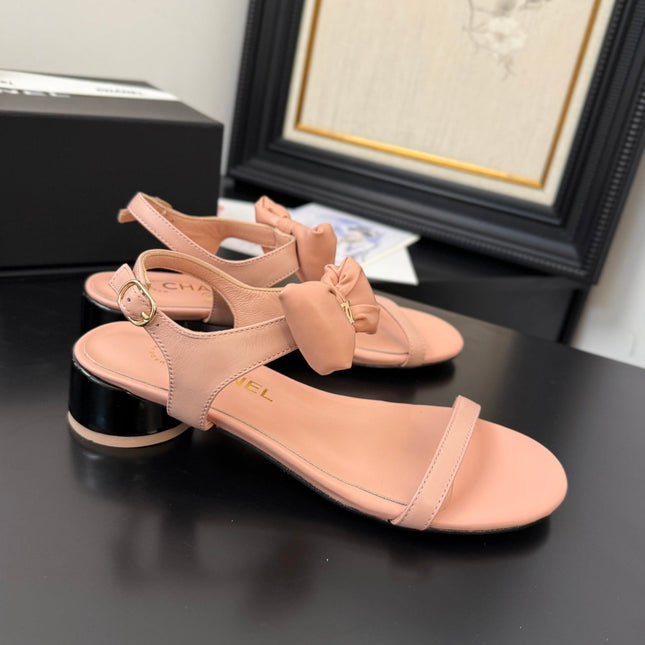 FLAT SANDALS IN PEACHY PINK CALFSKIN WITH BOW