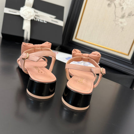 FLAT SANDALS IN PEACHY PINK CALFSKIN WITH BOW