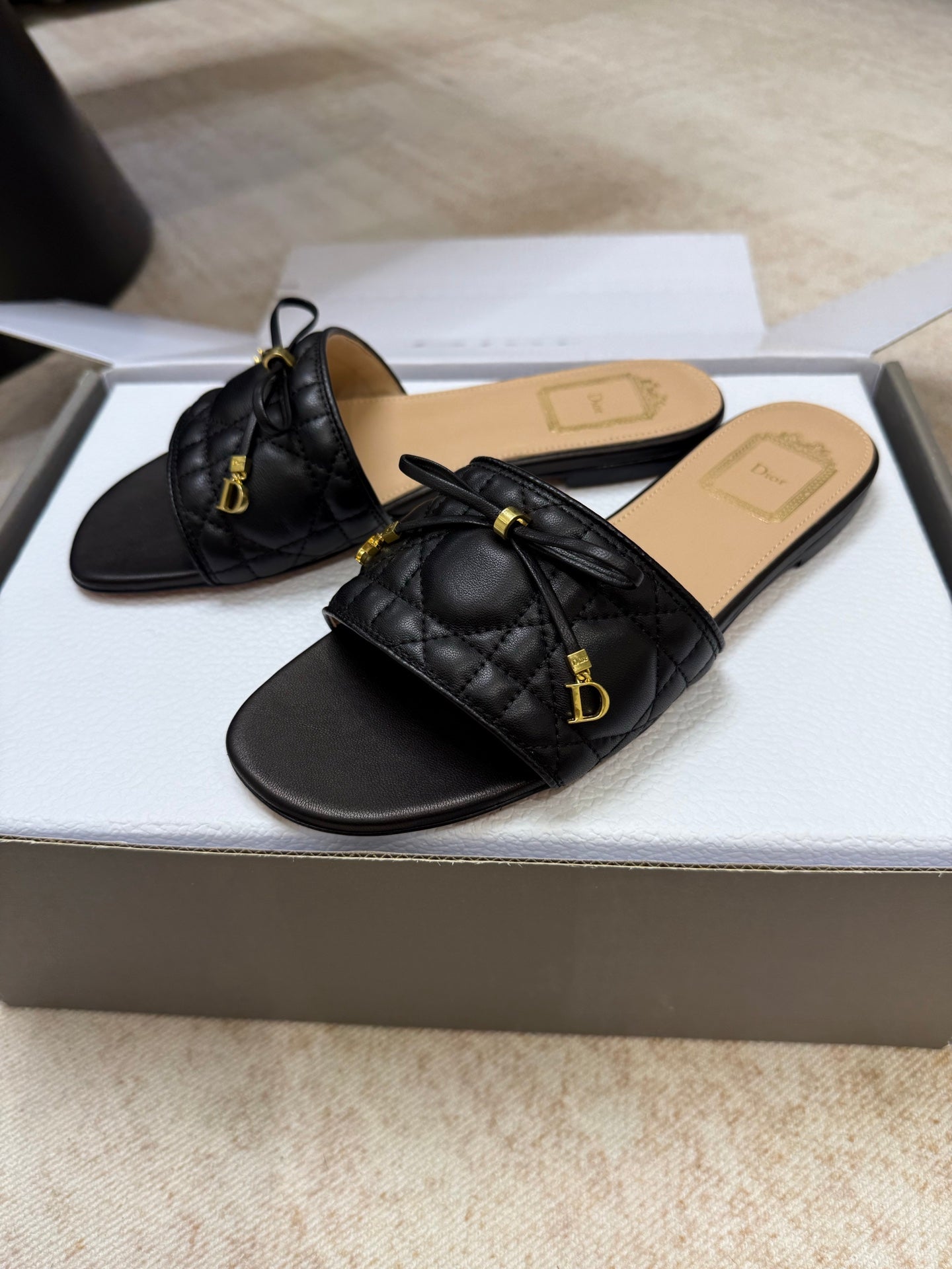 DIOR 26S DWAY CANNAGE SLIDE IN BLACK LAMBSKIN