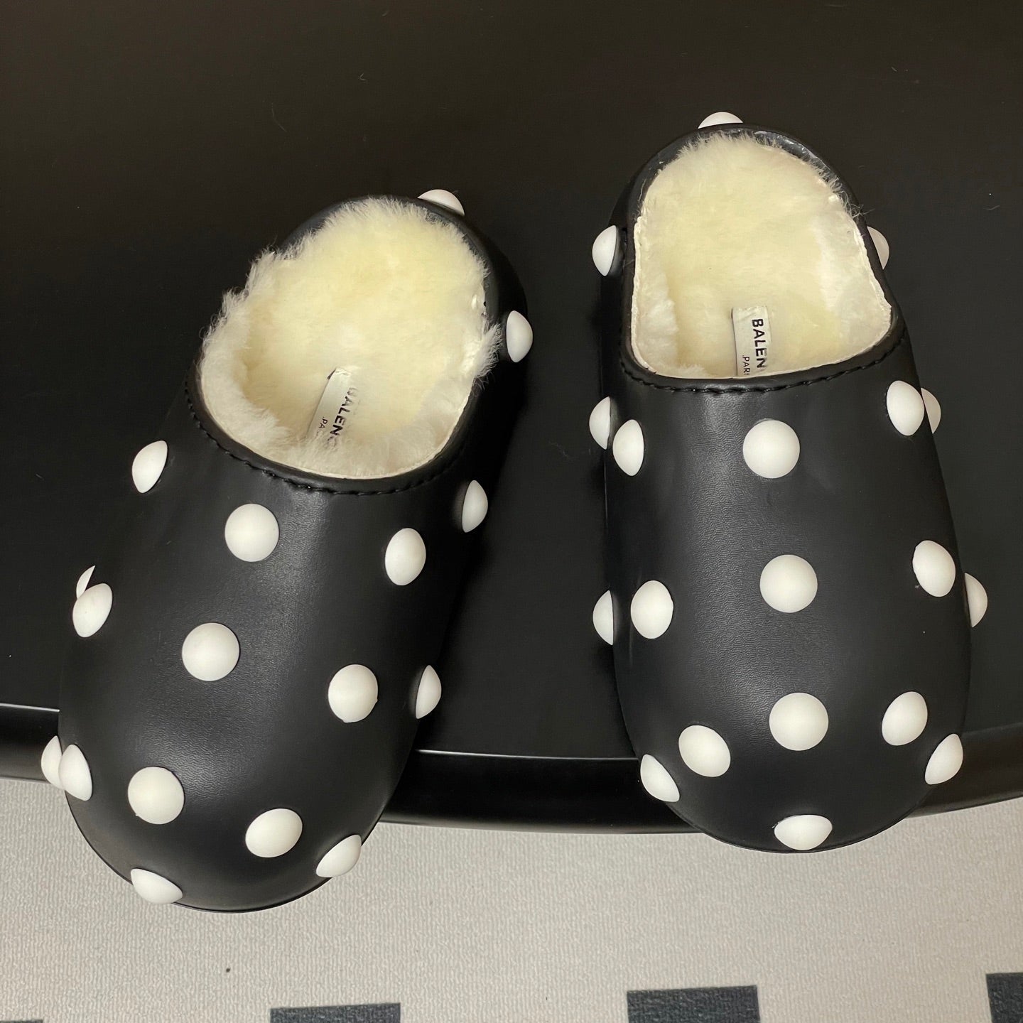 BALENCIAGA 25S FUR-LINED MULES IN BLACK AND WHITE FAUX LEATHER