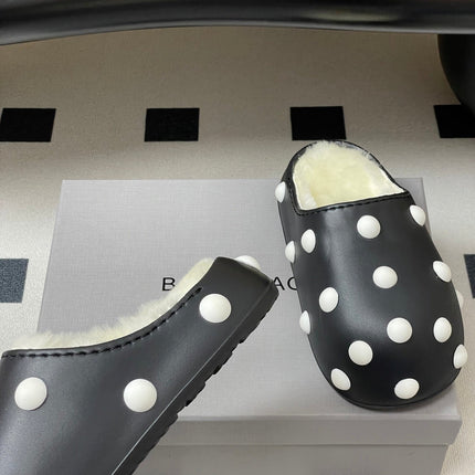 BALENCIAGA 25S FUR-LINED MULES IN BLACK AND WHITE FAUX LEATHER