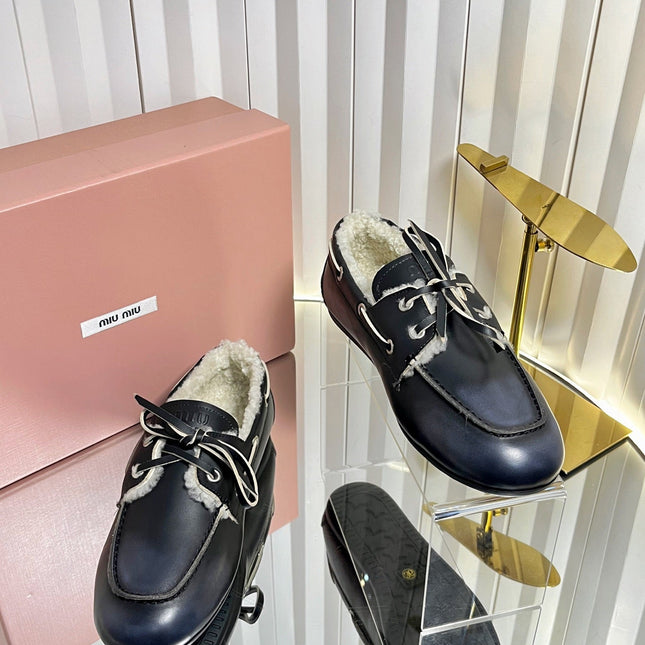 MIUMIU 26S FUR BOAT SHOES IN BLACK CALFSKIN