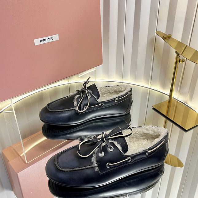 MIUMIU 26S FUR BOAT SHOES IN BLACK CALFSKIN