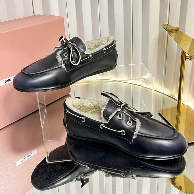 MIUMIU 26S FUR BOAT SHOES IN BLACK CALFSKIN