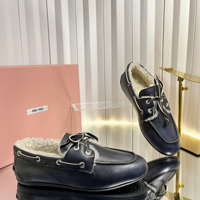 MIUMIU 26S FUR BOAT SHOES IN BLACK CALFSKIN