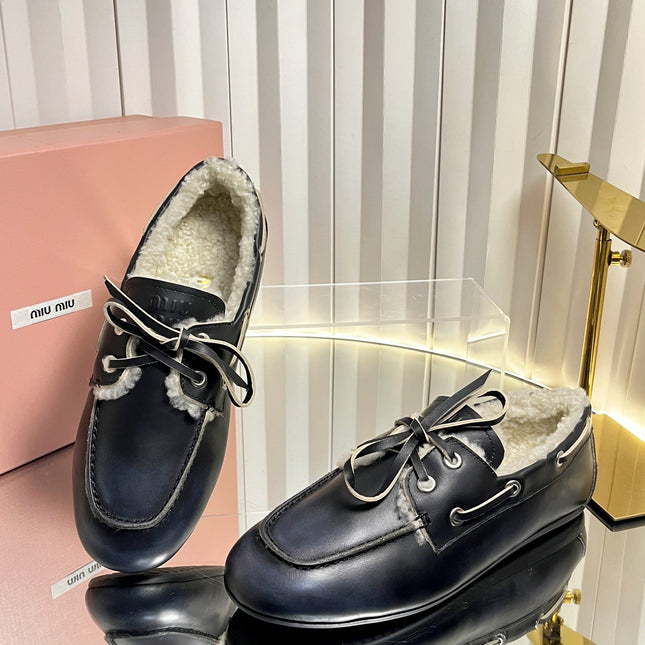 MIUMIU 26S FUR BOAT SHOES IN BLACK CALFSKIN