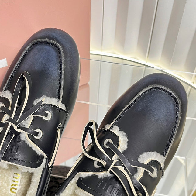 MIUMIU 26S FUR BOAT SHOES IN BLACK CALFSKIN