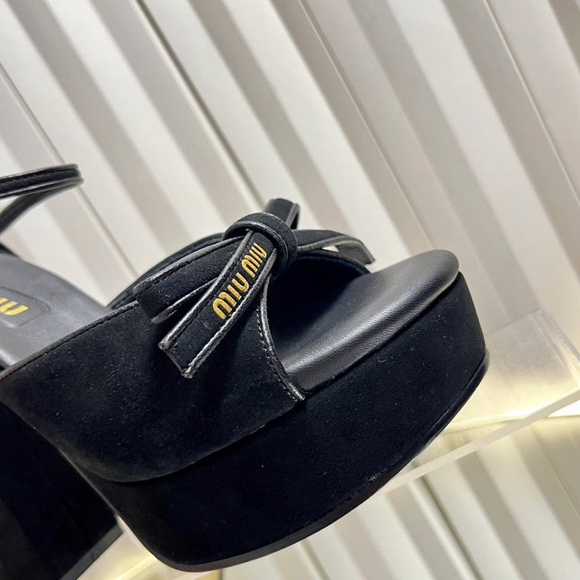 MIUMIU 26S PLATFORM ANKLE STRAP SANDALS 120MM IN BLACK SUEDE WITH BOW
