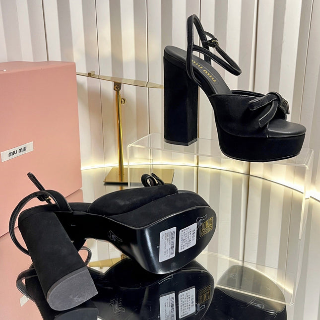 MIUMIU 26S PLATFORM ANKLE STRAP SANDALS 120MM IN BLACK SUEDE WITH BOW