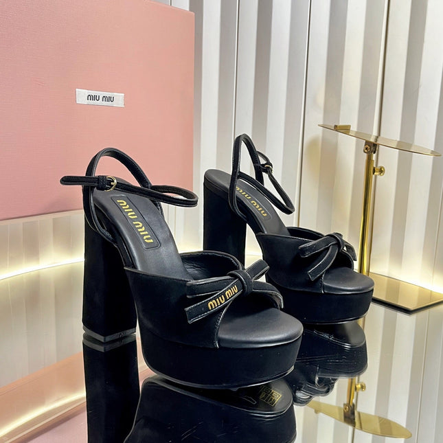 MIUMIU 26S PLATFORM ANKLE STRAP SANDALS 120MM IN BLACK SUEDE WITH BOW