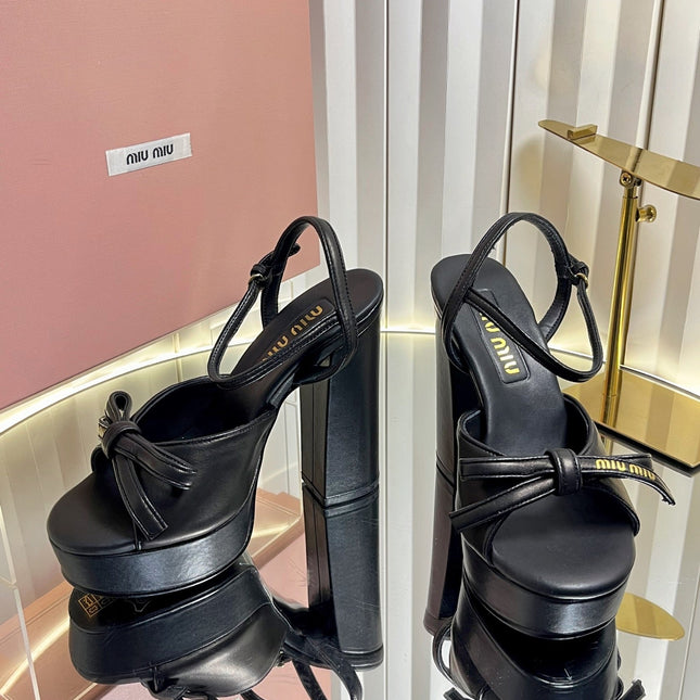 MIUMIU 26S PLATFORM ANKLE STRAP SANDALS 120MM IN BLACK CALFSKIN WITH BOW