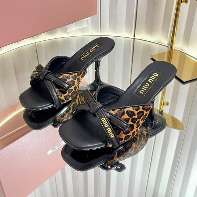 MIUMIU 26S MULE SANDALS 55MM IN LEOPARD PRINT CALF HAIR WITH BOW