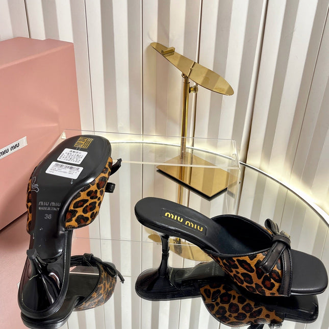 MIUMIU 26S MULE SANDALS 55MM IN LEOPARD PRINT CALF HAIR WITH BOW