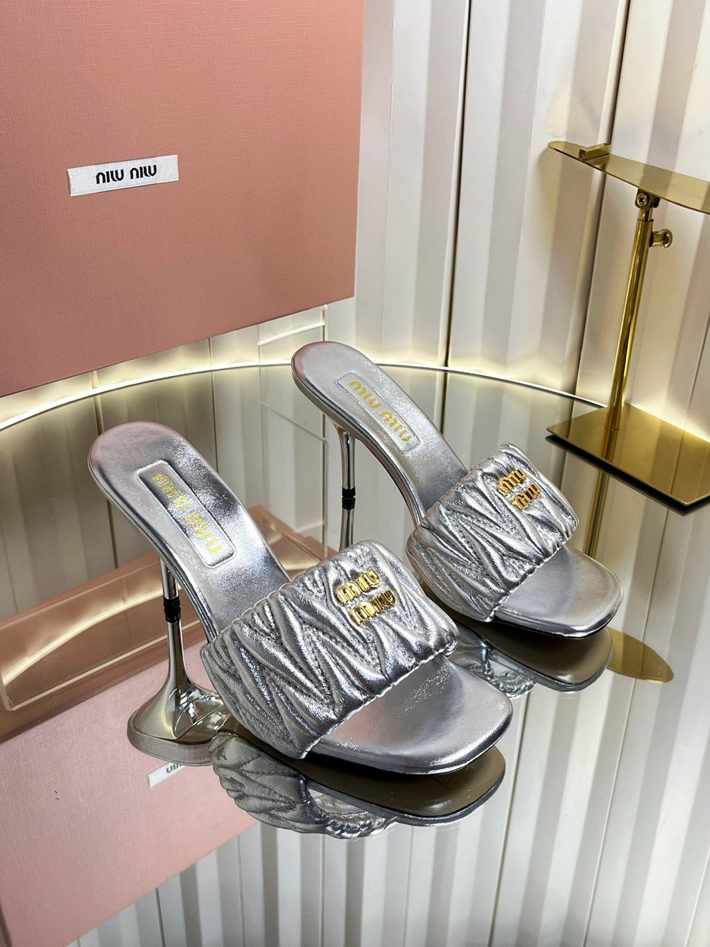 MIUMIU 26S HIGH-HEEL MULE SANDALS 85MM IN SILVER CALFSKIN GOLD HARDWARE
