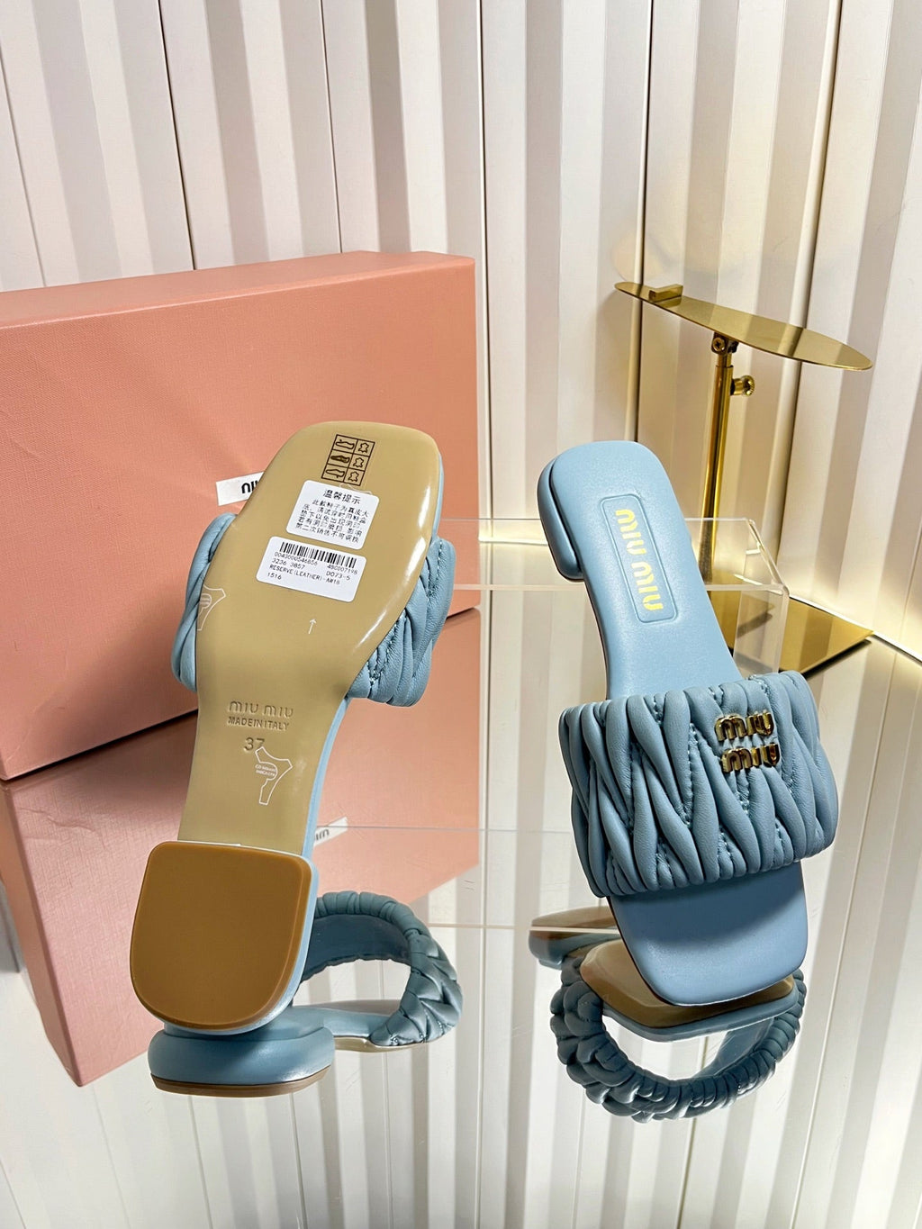 MIUMIU 26S MATELASSE SLIDES IN LIGHT BLUE CALFSKIN GOLD HARDWARE