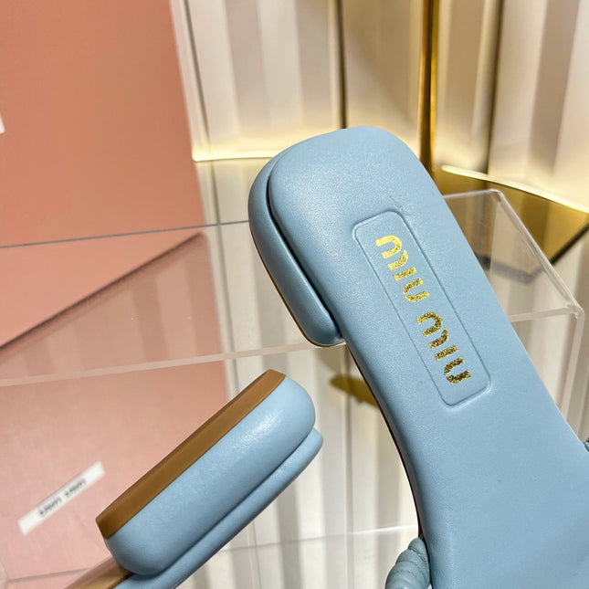 MIUMIU 26S MATELASSE SLIDES IN LIGHT BLUE CALFSKIN GOLD HARDWARE