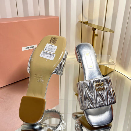 MIUMIU 26S MATELASSE SLIDES IN SILVER CALFSKIN GOLD HARDWARE