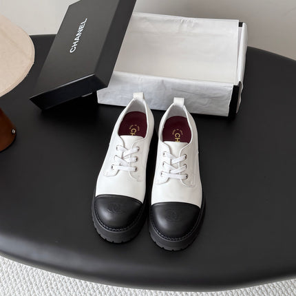 CHANEL 26S LACE UP PLATFORM IN BLACK AND WHITE CALFSKIN