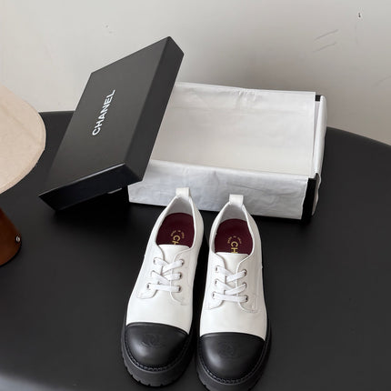 CHANEL 26S LACE UP PLATFORM IN BLACK AND WHITE CALFSKIN