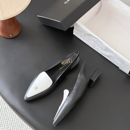 CHANEL 26S SLINGBACK FLAT IN BLACK AND WHITE CALFSKIN WITH CC LOGO