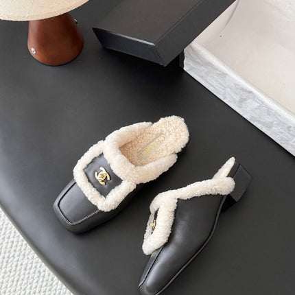CHANEL 26S MULES IN BLACK SHEARLING AND CALFSKIN