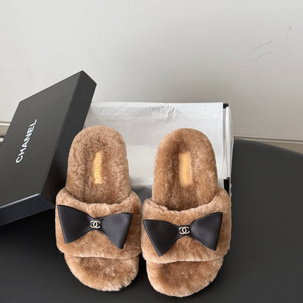 CHANEL 26S SLIDE SANDALS IN BROWN SHEARLING WITH BLACK BOW