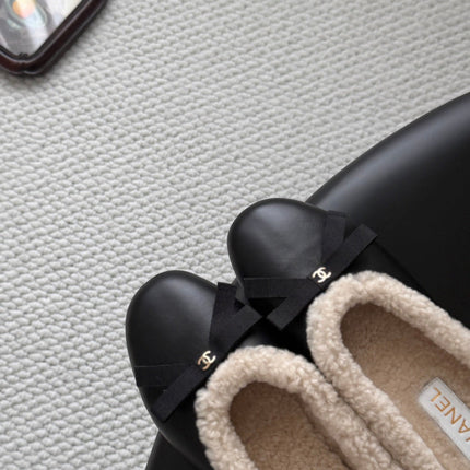 CHANEL 26S MULES IN BLACK LAMBSKIN AND SHEARLING