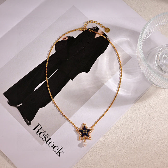 CD 26S PEARL STAR LOGO PENDANT NECKLACE IN GOLD TONE METAL