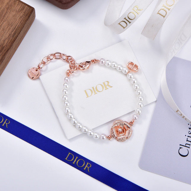 CD 26S PEARL FLOWER CHARM BRACELET IN ROSE GOLD TONE METAL 631860