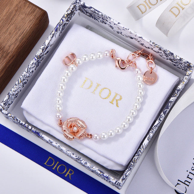 CD 26S PEARL FLOWER CHARM BRACELET IN ROSE GOLD TONE METAL 631860