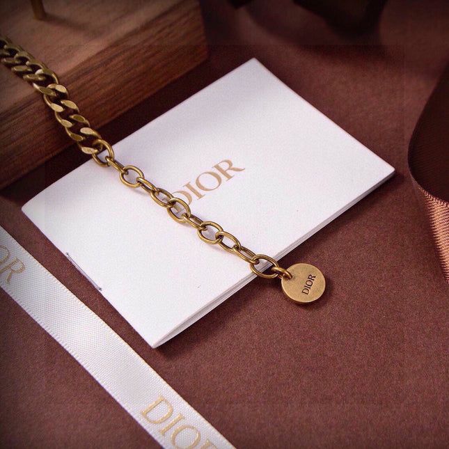 CD 26S DIOR LOGO PINK CRYSTAL CHAIN NECKLACE IN AGED GOLD METAL 633118