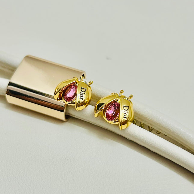 CD 26S LADYBUG PINK CRYSTAL STUD EARRINGS IN GOLD TONE METAL 644370