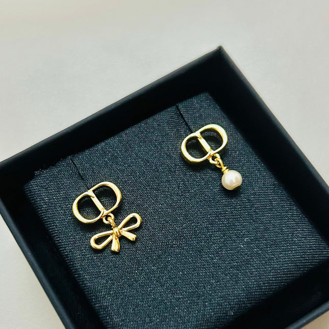 CD 26S MINI BOW PEARL DROP EARRINGS IN GOLD TONE METAL 646612