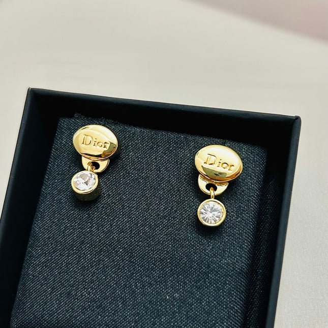 CD 26S CRYSTAL DROP LOGO STUD EARRINGS IN GOLD TONE METAL 646613