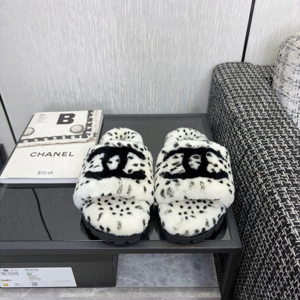 CHANEL 26S PLATFORM SLIDE SANDALS IN WHITE AND BLACK SHEARLING DALMATIAN PRINT