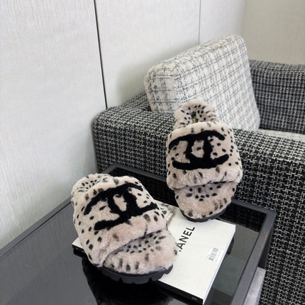 CHANEL 26S PLATFORM SLIDE SANDALS IN GRAY AND BLACK SHEARLING DALMATIAN PRINT