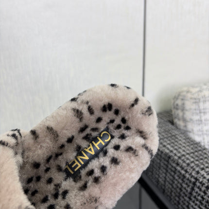 CHANEL 26S PLATFORM SLIDE SANDALS IN GRAY AND BLACK SHEARLING DALMATIAN PRINT