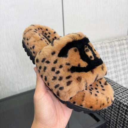 CHANEL 26S PLATFORM SLIDE SANDALS IN CAMEL AND BLACK SHEARLING DALMATIAN PRINT