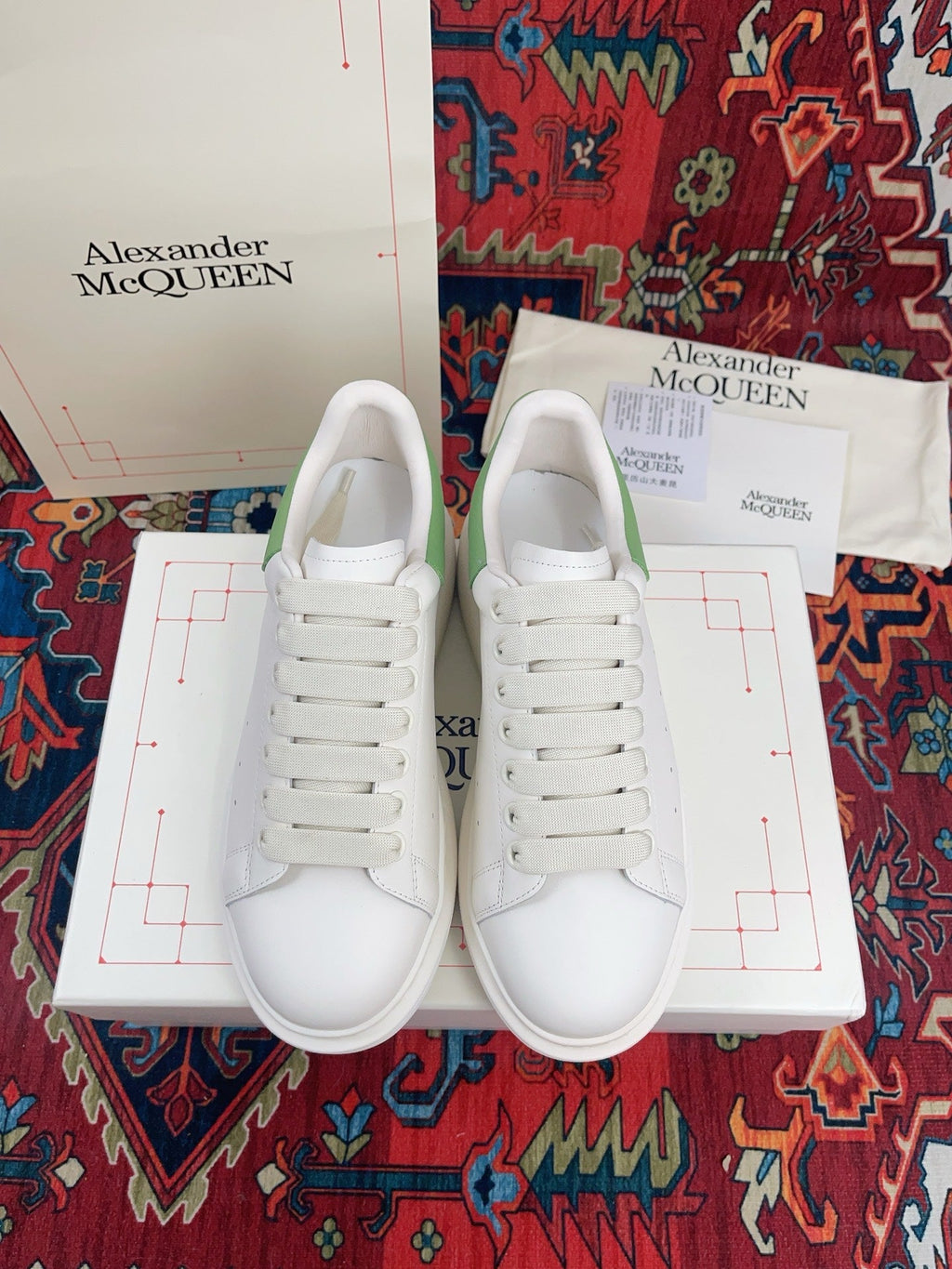 OVERSIZED SNEAKER IN WHITE CALFSKIN WITH EMBOSSED HUNTER GREEN HEEL TAB