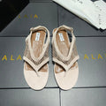 ALAIA 26S FLAT MESH THONG SANDALS IN BEIGE SUEDE