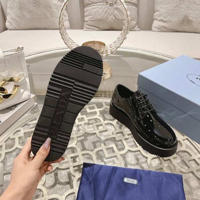 PRADA 26S LOAFERS IN BLACK PATENT CALFSKIN