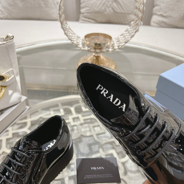 PRADA 26S LOAFERS IN BLACK PATENT CALFSKIN
