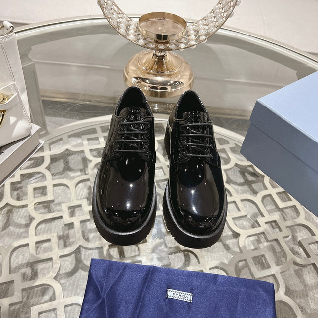 PRADA 26S LOAFERS IN BLACK PATENT CALFSKIN