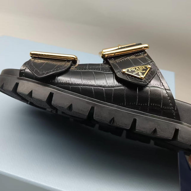 PRADA 26S STRAP SLIDES IN BLACK CROC EMBOSSED CALFSKIN GOLD HARDWARE
