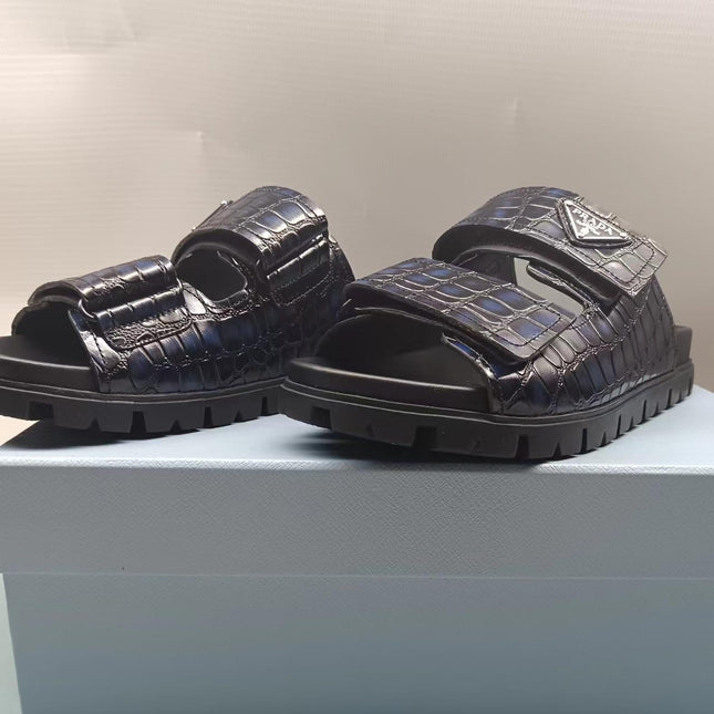 PRADA 26S STRAP SLIDES IN BLACK CROC EMBOSSED CALFSKIN