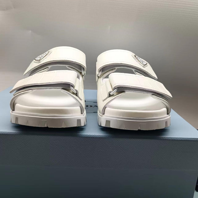 PRADA 26S STRAP SLIDES IN IVORY WHITE CROC EMBOSSED CALFSKIN